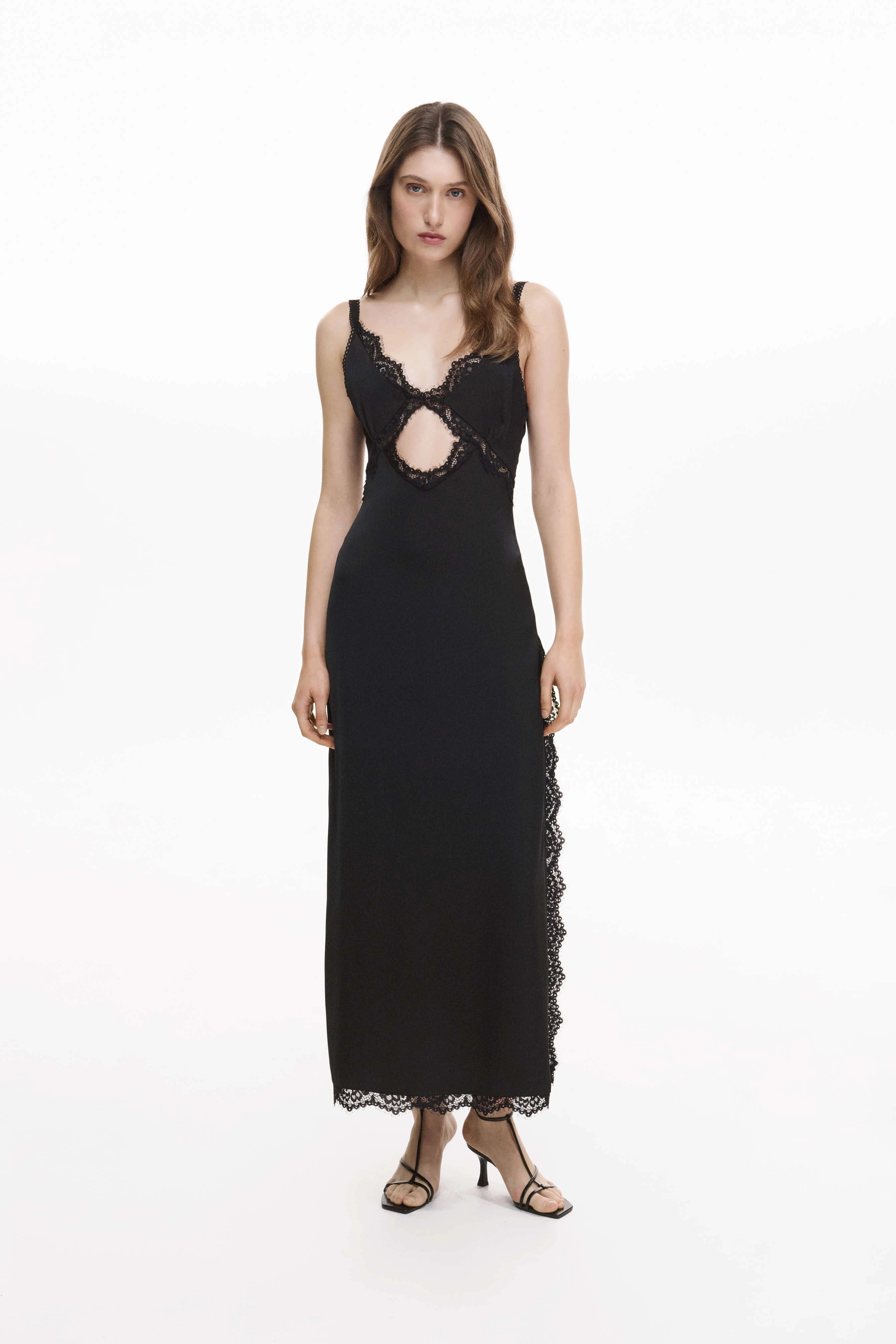 Black lace maxi dress with side slit and sheer lace panel detail